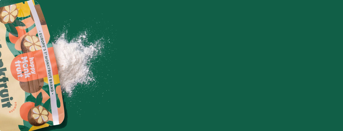Happy Monkfruit powder pouch on a deep green background